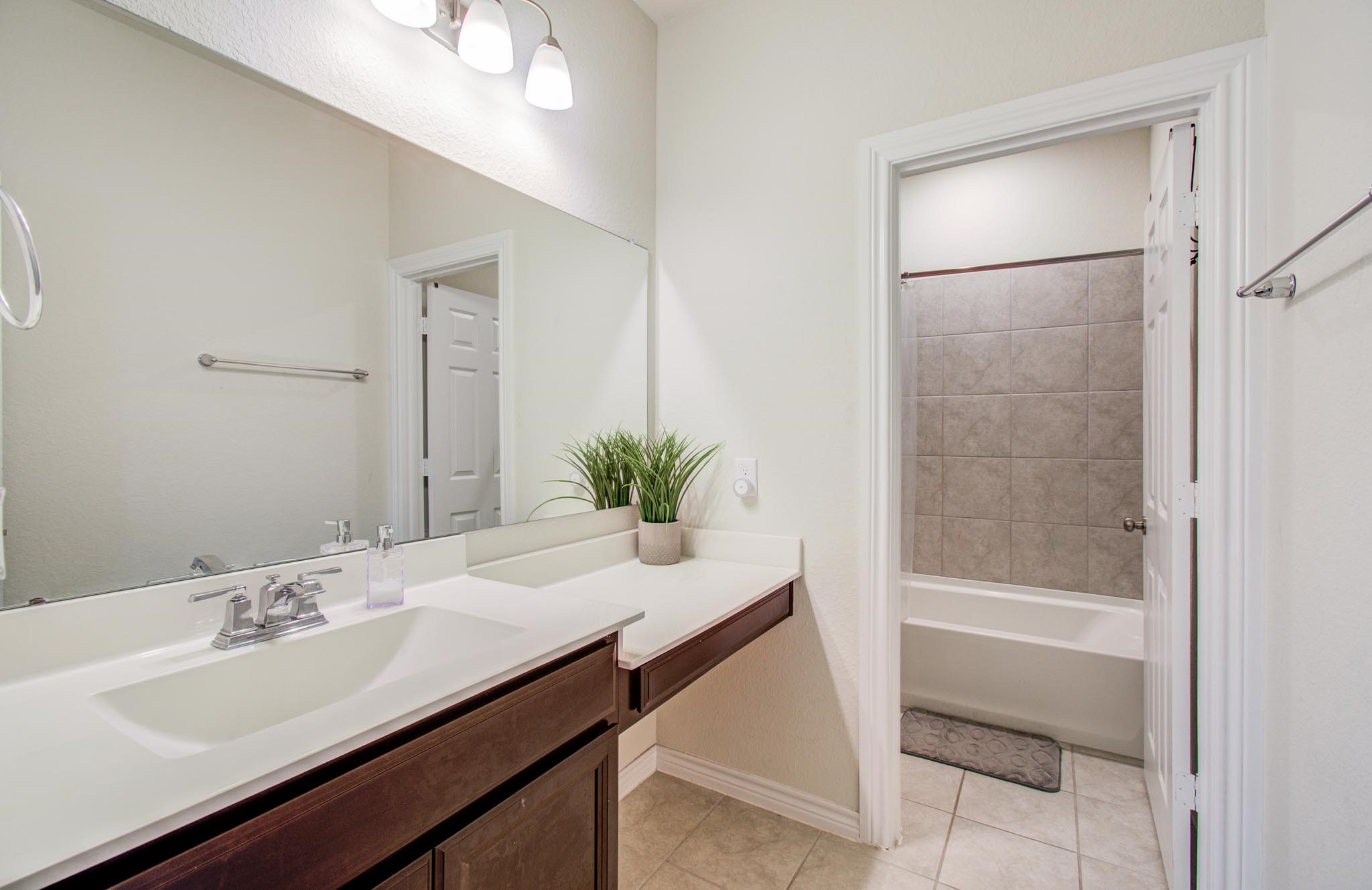 27817 Ellie Oak Lane Spring, TX 77386 - Photo 40 of 49 a bathroom with a sink a tub and a mirror