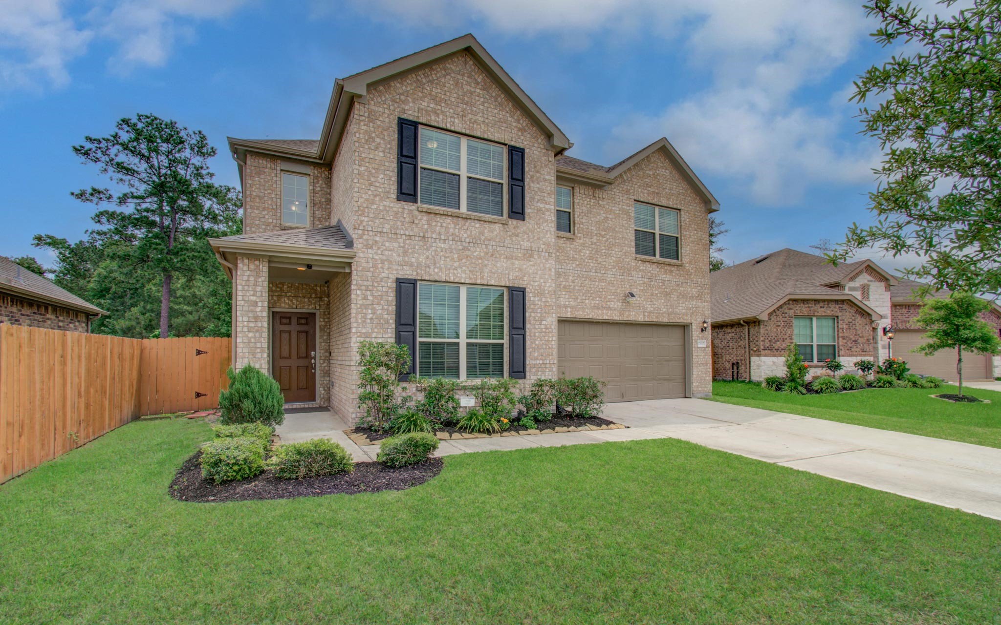 27817 Ellie Oak Lane Spring, TX 77386 - Photo 4 of 49 a front view of a house with garden