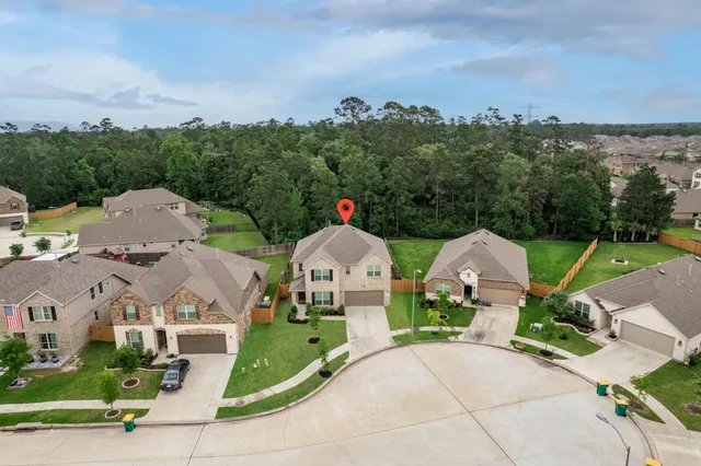 an aerial view of a house with swimming pool