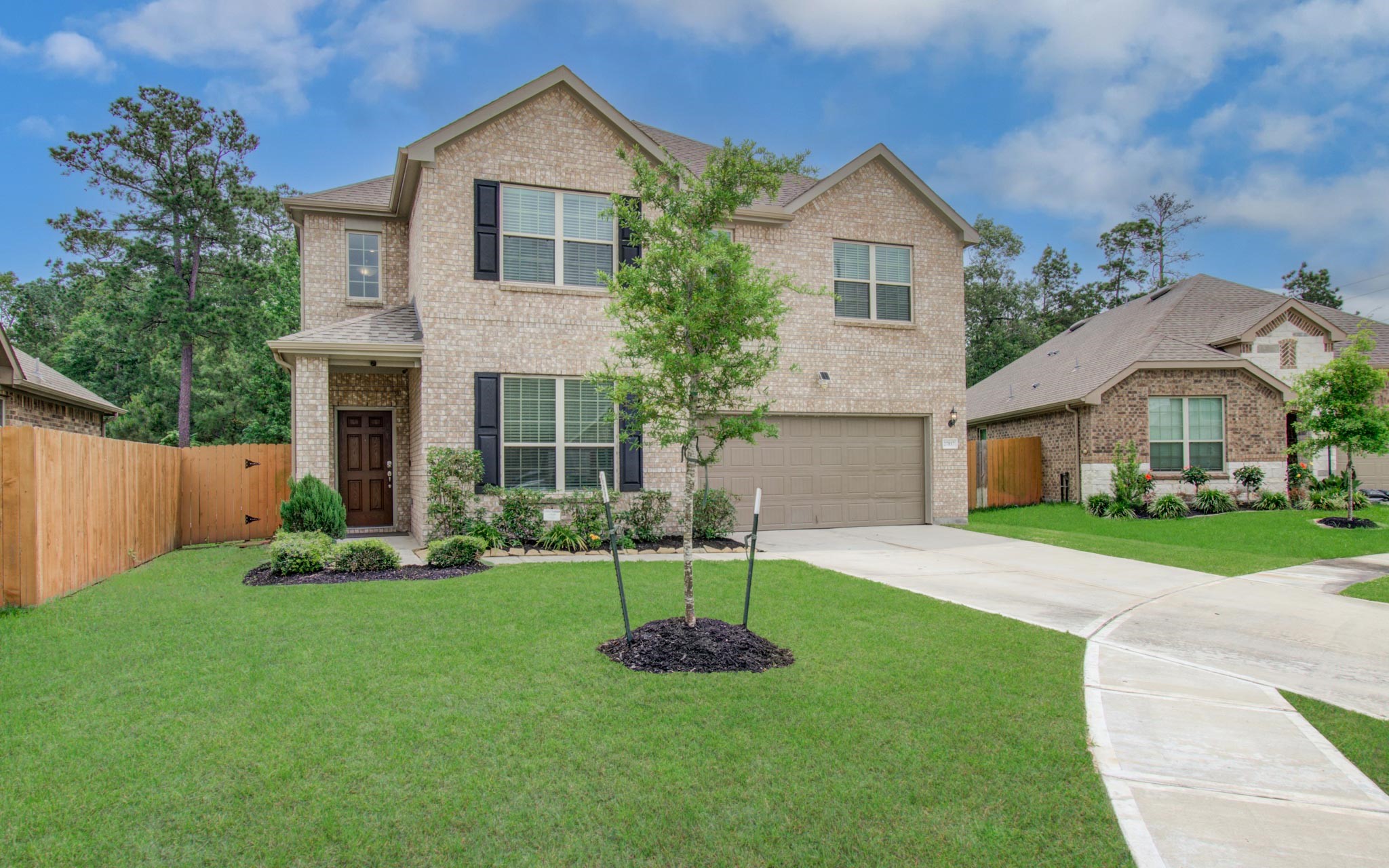 27817 Ellie Oak Lane Spring, TX 77386 - Photo 48 of 49 a front view of a house with a garden and yard