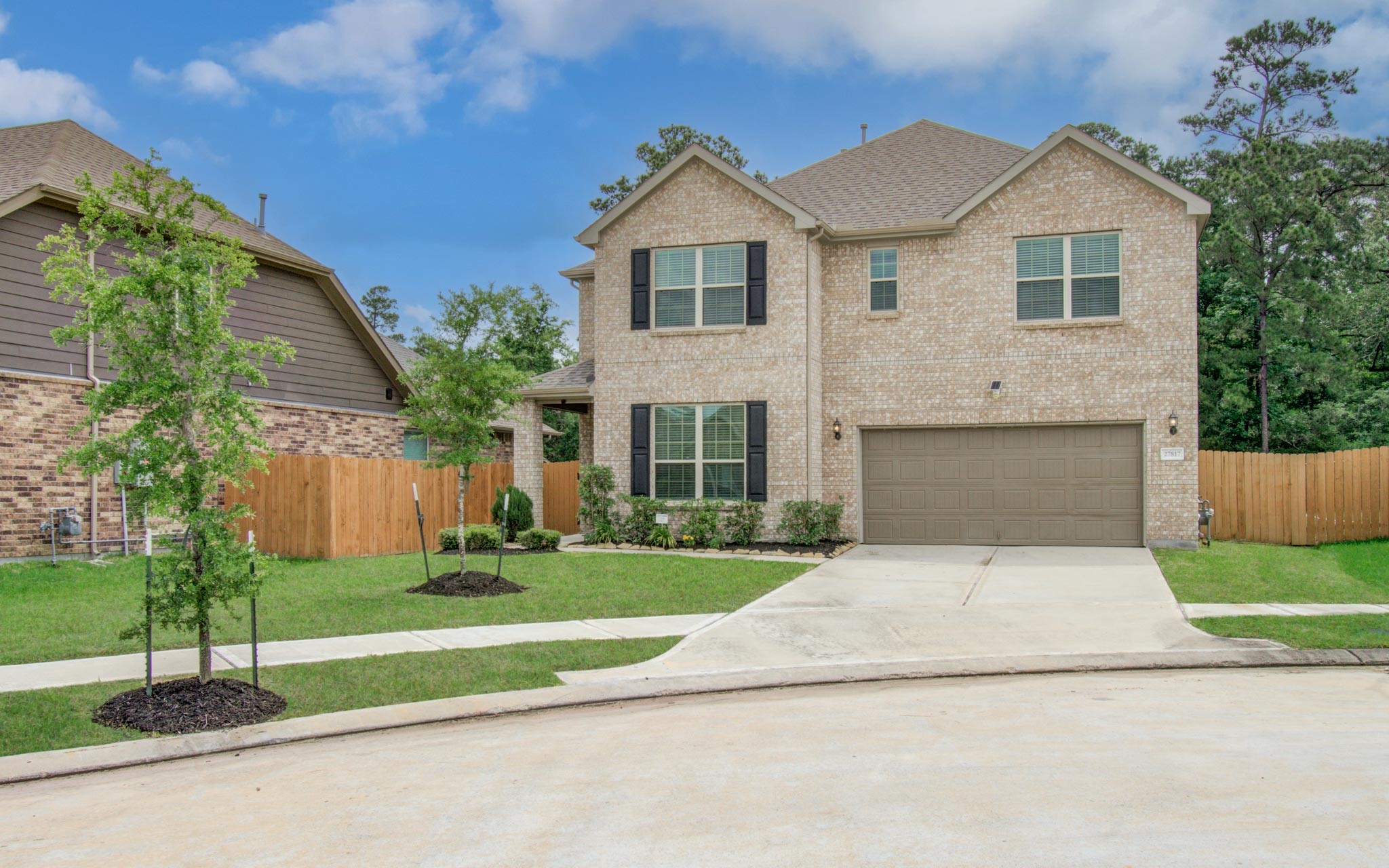 27817 Ellie Oak Lane Spring, TX 77386 - Photo 49 of 49 a front view of a house with a yard and trees