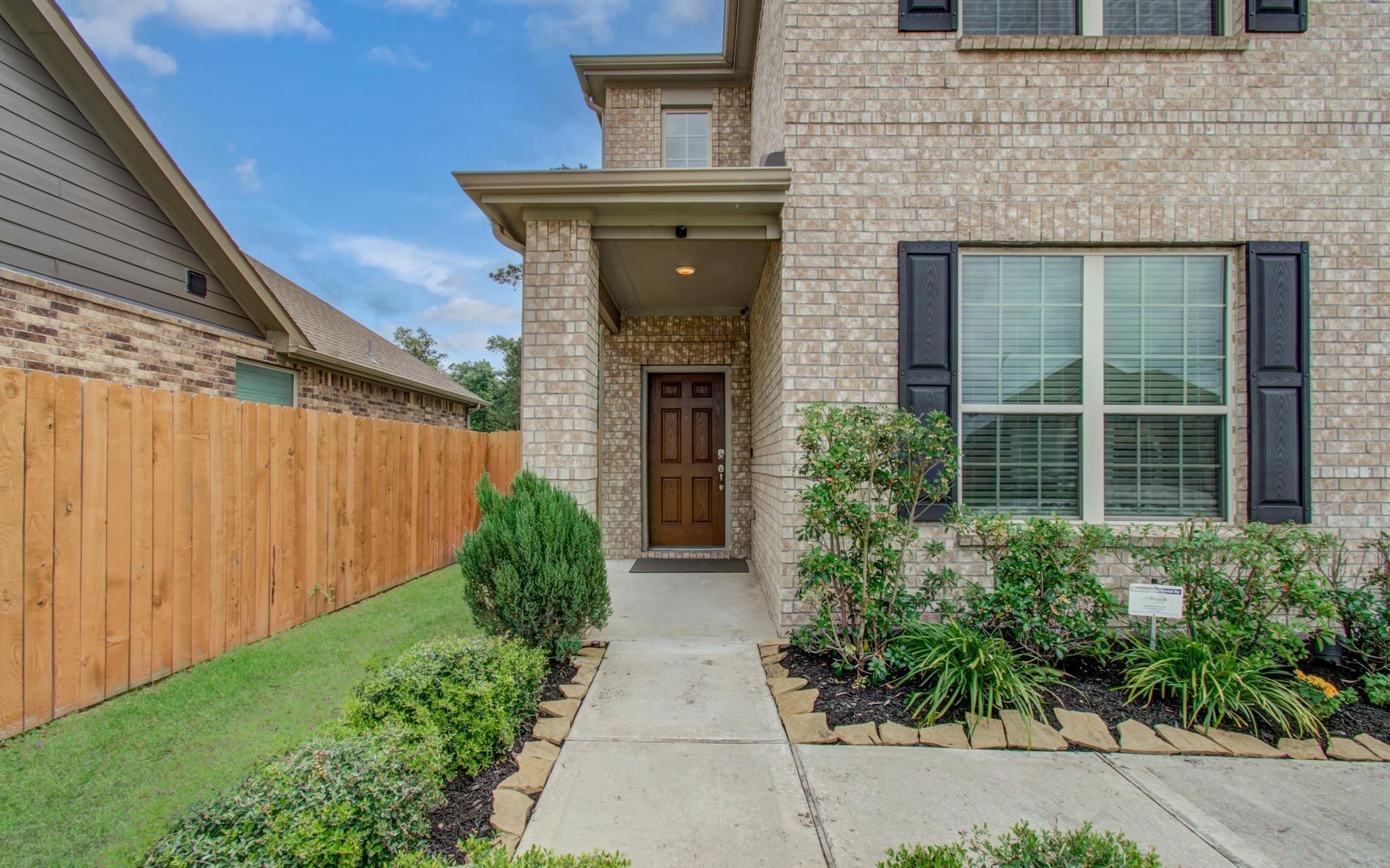 27817 Ellie Oak Lane Spring, TX 77386 - Photo 5 of 49 a front view of a house with garden