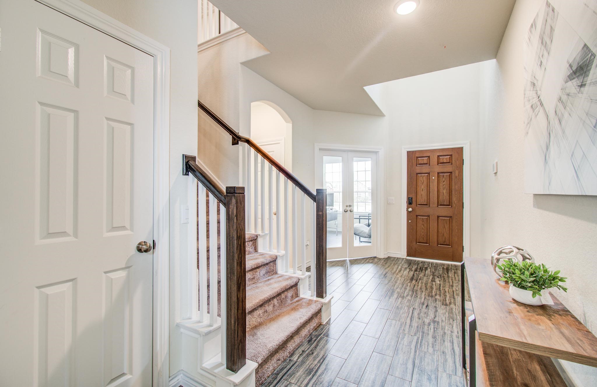27817 Ellie Oak Lane Spring, TX 77386 - Photo 7 of 49 a view of an entryway with wooden floor and windows