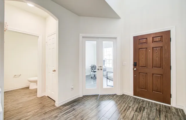 a view of entryway with wooden floor