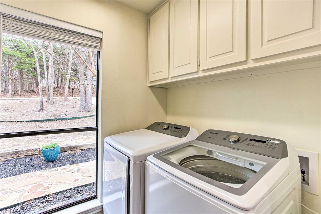 997 Tanglewood Trail Pottsboro, TX 75076 - Photo 18 of 35 Clothes washing area featuring cabinet space and washer and clothes dryer