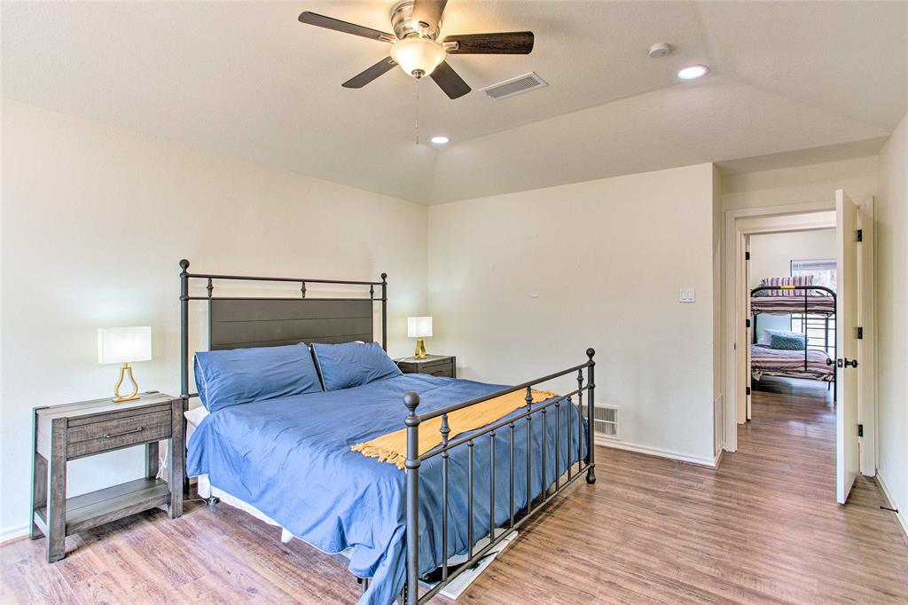 997 Tanglewood Trail Pottsboro, TX 75076 - Photo 19 of 35 Bedroom with visible vents, wood finished floors, baseboards, and recessed lighting