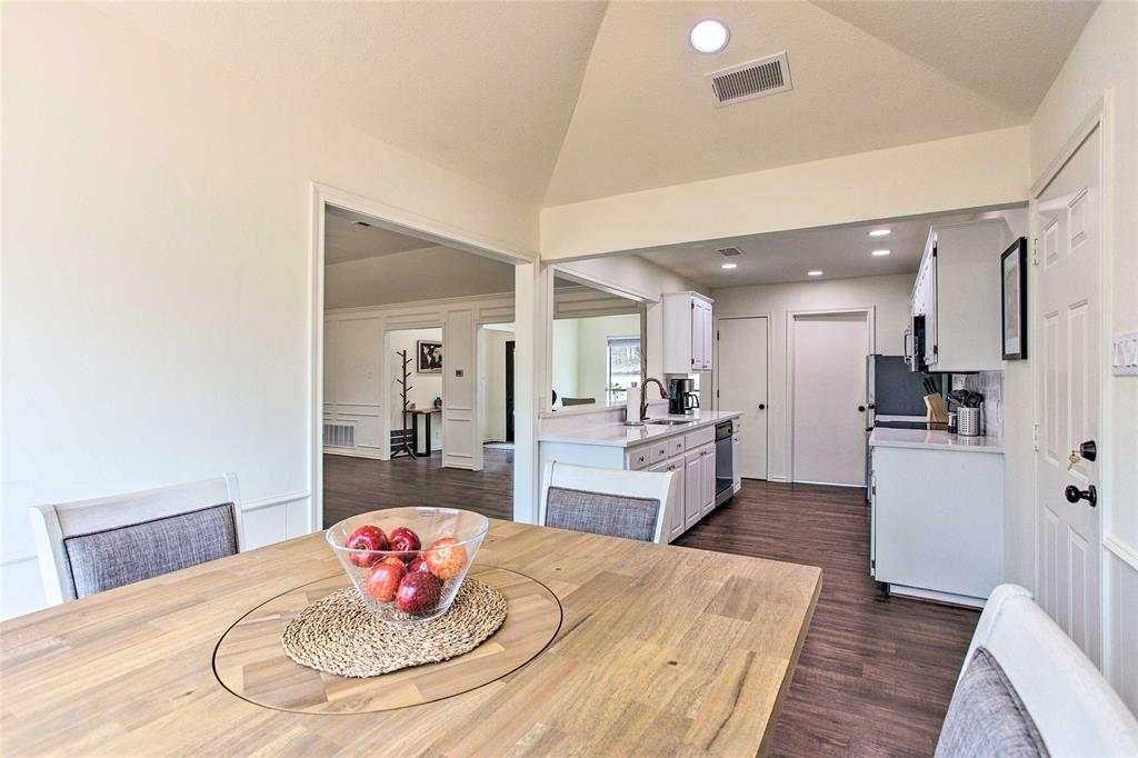 997 Tanglewood Trail Pottsboro, TX 75076 - Photo 31 of 35 Dining space featuring vaulted ceiling, recessed lighting, visible vents, and dark wood finished floors