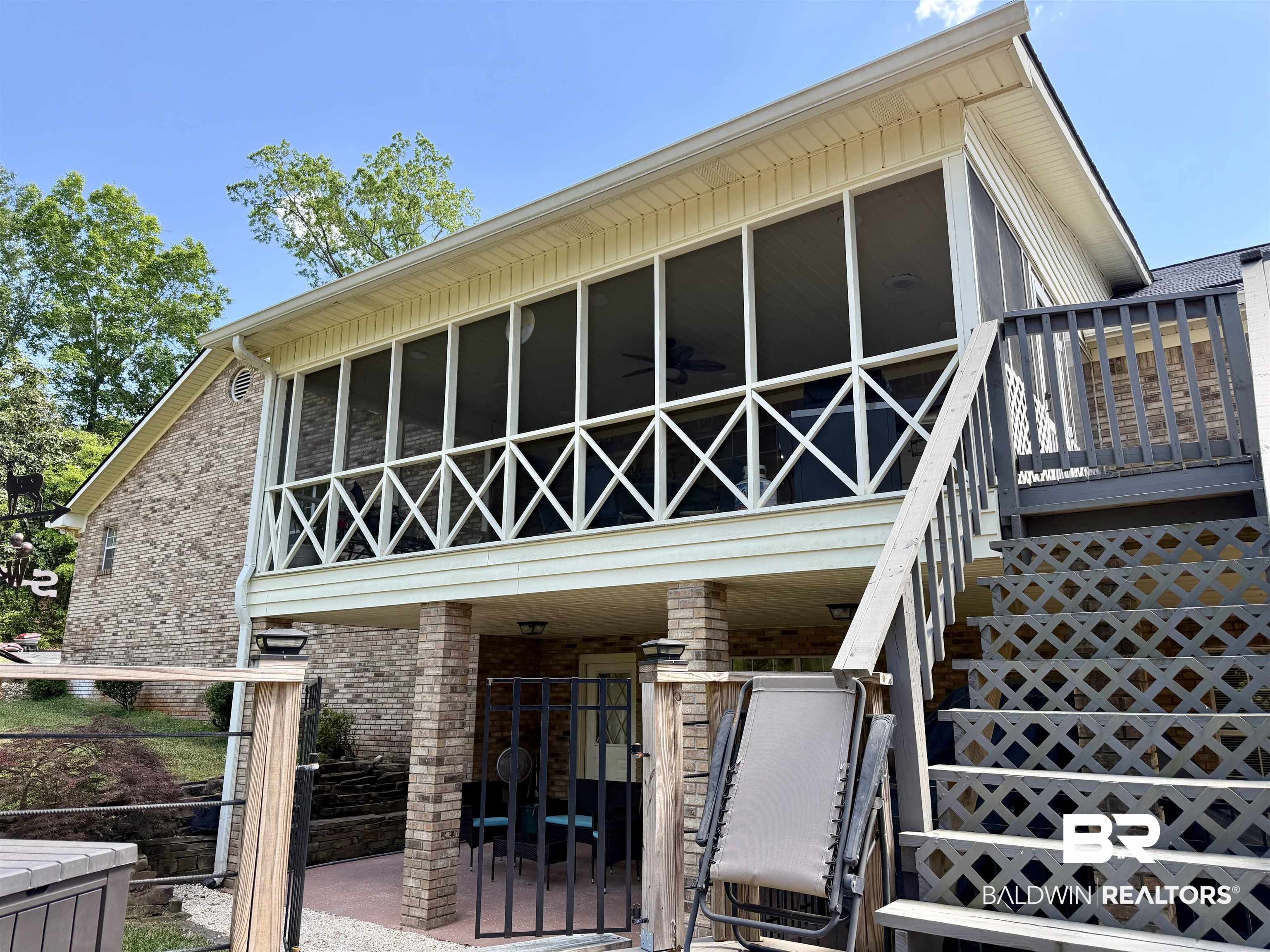 2944 Appleton Road Brewton, AL 36426 - Photo 56 of 65 Rear view of property featuring brick siding and a patio