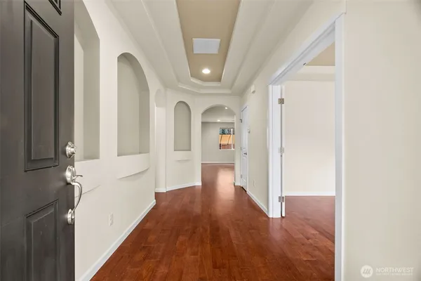 a view of entryway with wooden floor