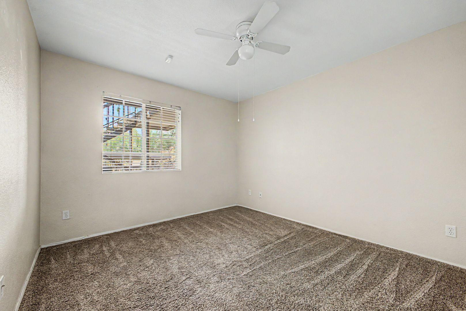 1720 East Thunderbird Road, Unit 1086 Phoenix, AZ 85022 - Photo 13 of 32 an empty room with windows