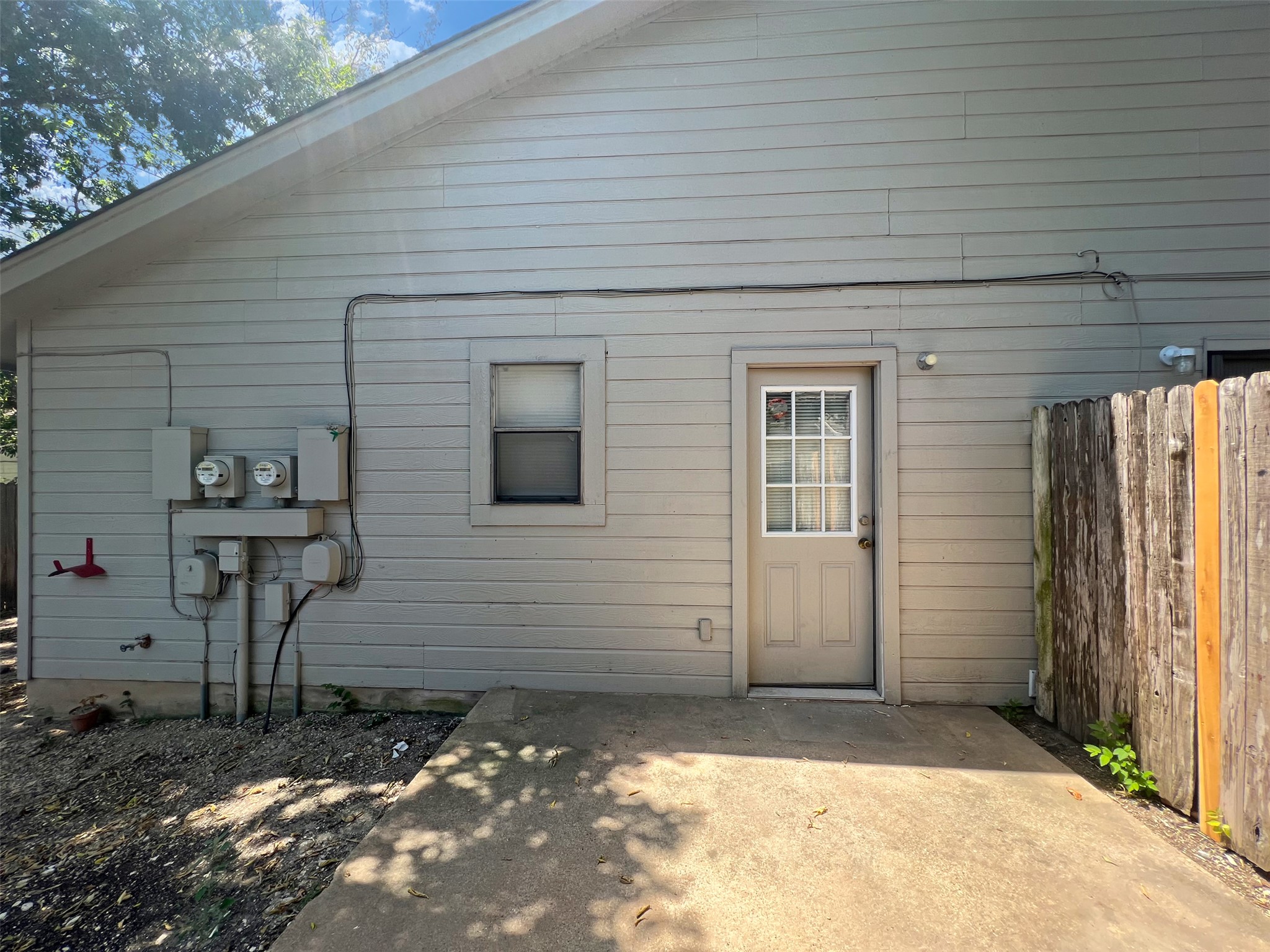 2010 Alex Avenue, Unit B Austin, TX 78728 - Photo 20 of 20 Backyard with an Open Patio and with a Wooden Fence