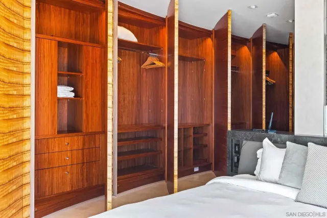 a bedroom with a bed and ceiling fan