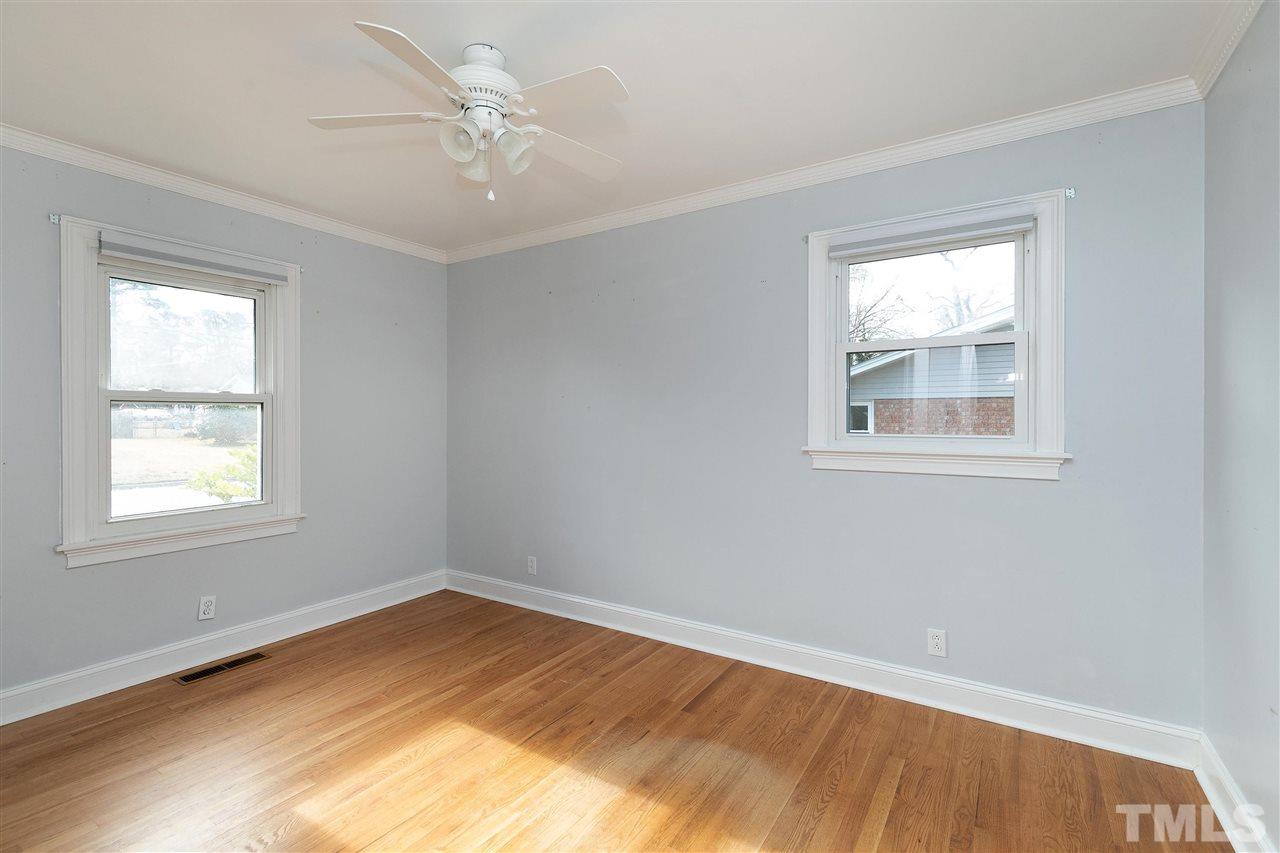 3105 Julian Drive Raleigh, NC 27604 - Photo 12 of 30 a view of empty room with wooden floor and fan