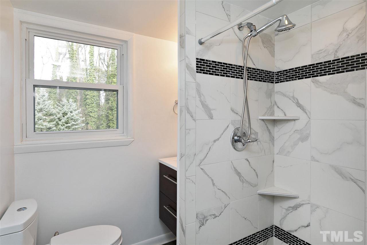 3105 Julian Drive Raleigh, NC 27604 - Photo 21 of 30 a bathroom with a toilet and a shower
