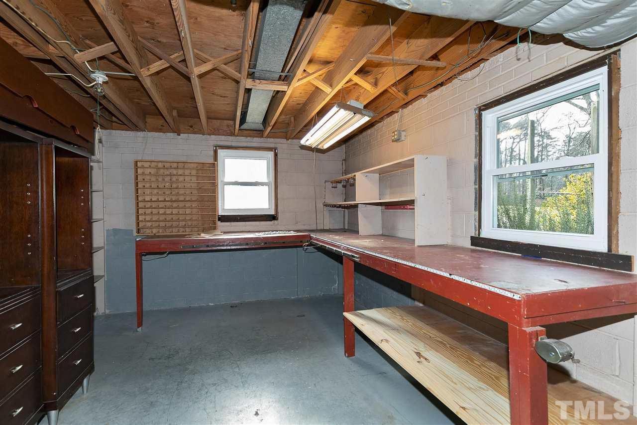 3105 Julian Drive Raleigh, NC 27604 - Photo 25 of 30 a kitchen with stainless steel appliances granite countertop a stove and a refrigerator