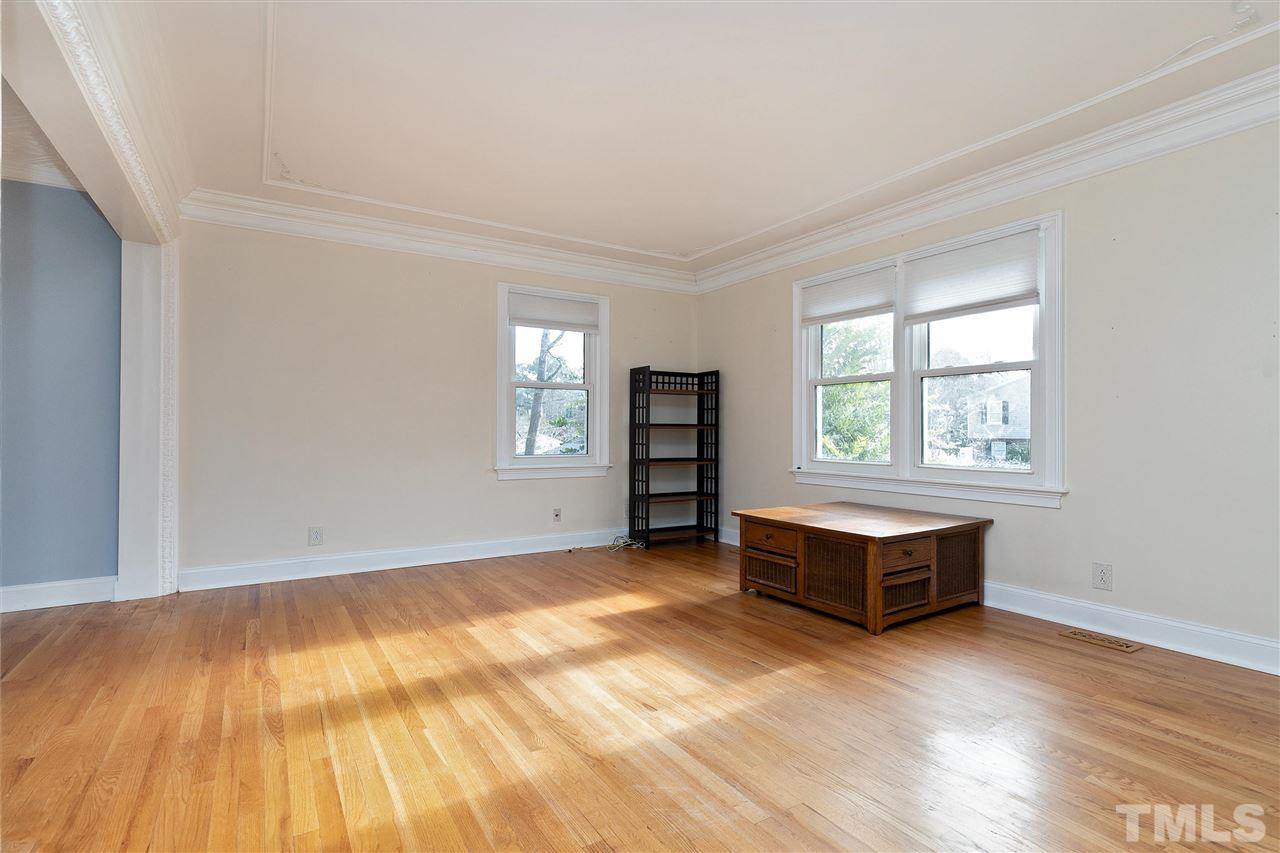 3105 Julian Drive Raleigh, NC 27604 - Photo 5 of 30 an empty room with wooden floor and windows