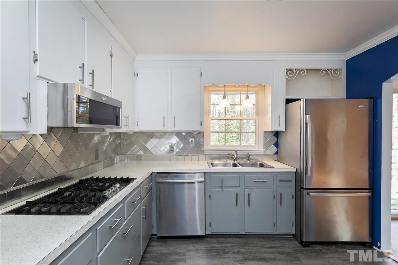 3105 Julian Drive Raleigh, NC 27604 - Photo 7 of 30 a kitchen with a white stove top oven and refrigerator