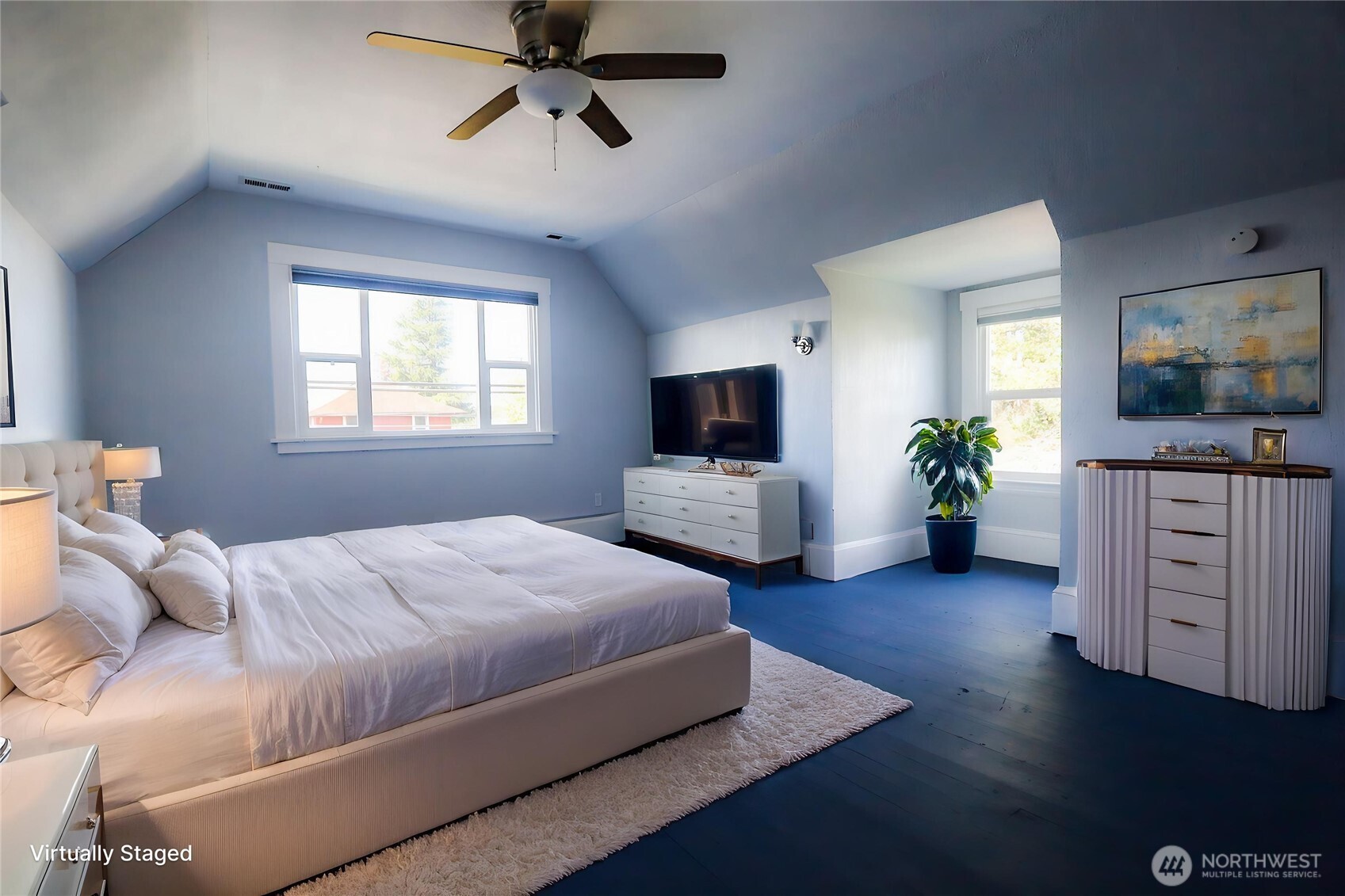 505 K Street Hoquiam, WA 98550 - Photo 14 of 40 a bedroom with a large bed and a flat tv screen on dresser