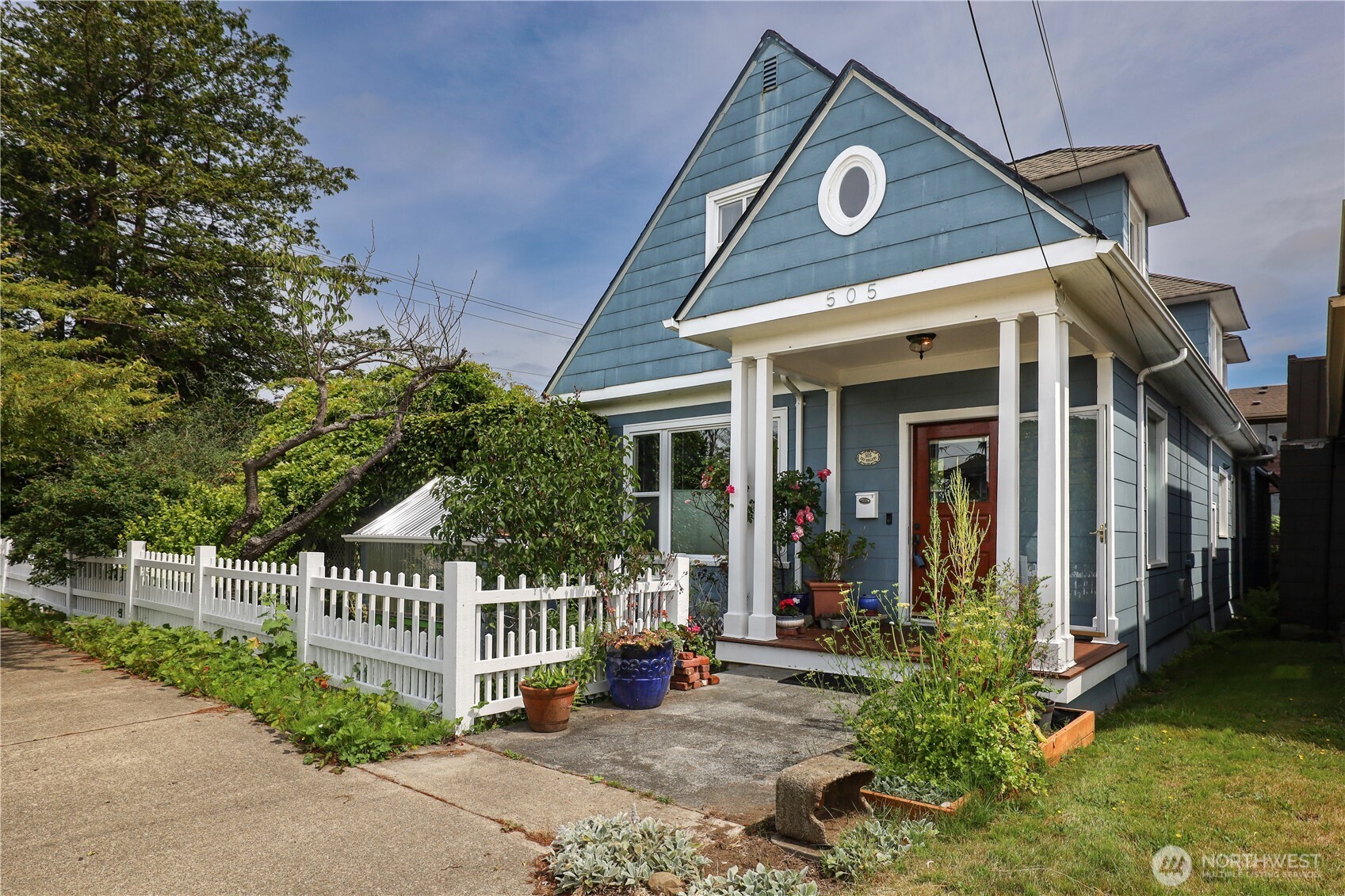 505 K Street Hoquiam, WA 98550 - Photo 3 of 40 a view of a house with a small yard and plants