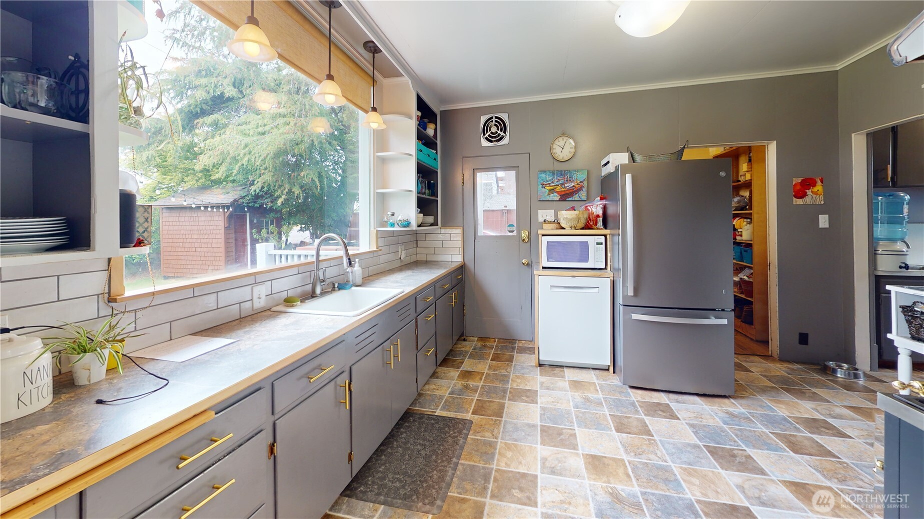505 K Street Hoquiam, WA 98550 - Photo 7 of 39 a kitchen with a refrigerator and a sink