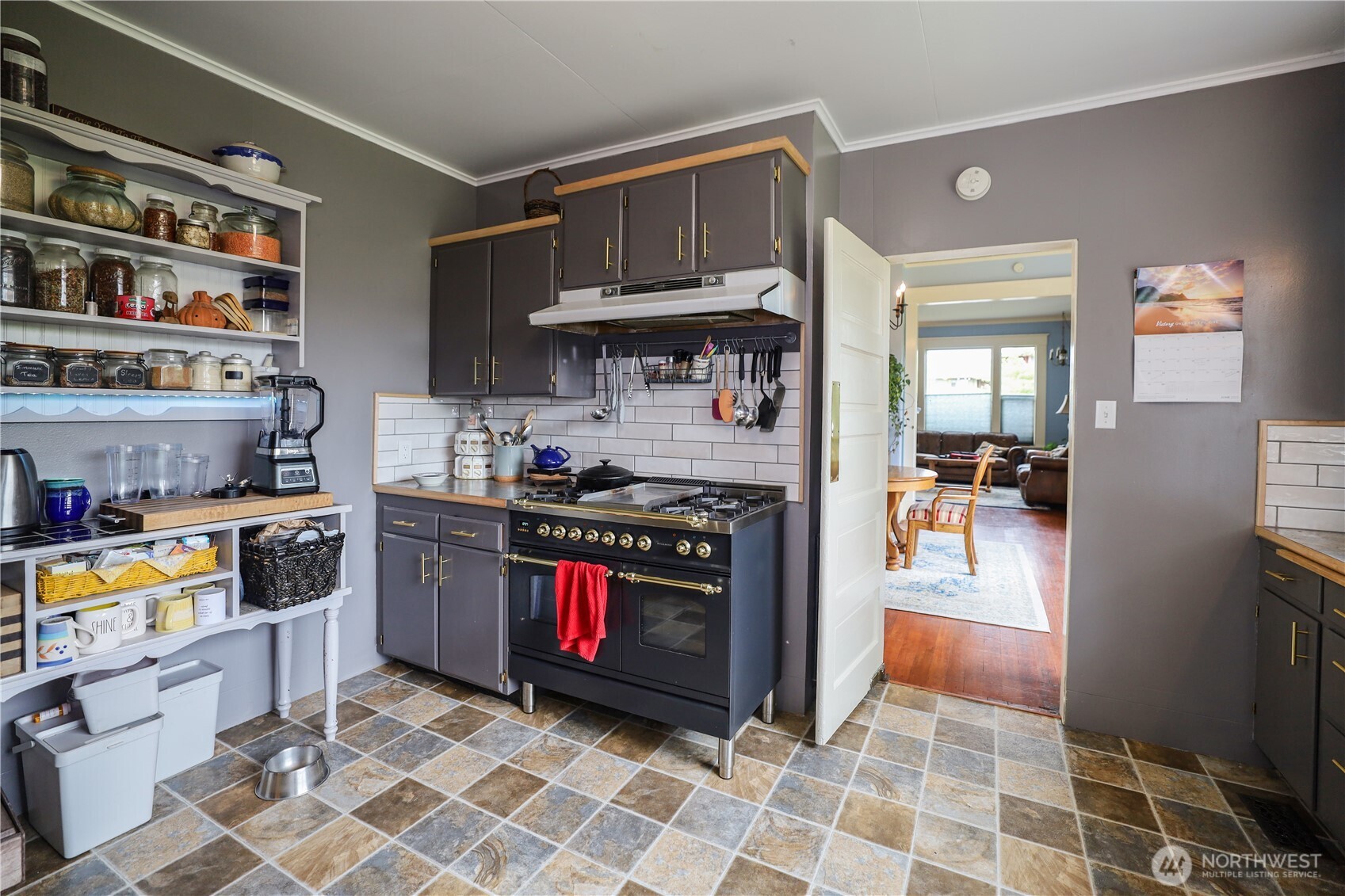 505 K Street Hoquiam, WA 98550 - Photo 8 of 39 a kitchen with stainless steel appliances granite countertop a stove a sink and a refrigerator