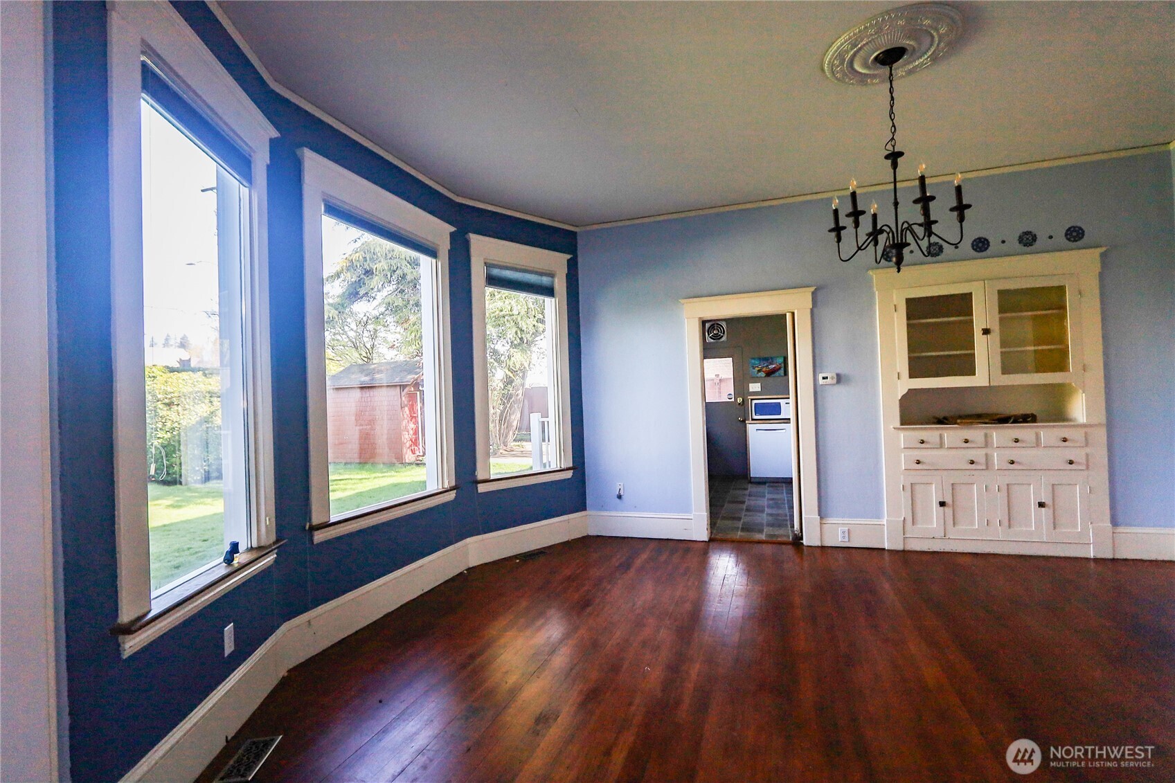 505 K Street Hoquiam, WA 98550 - Photo 8 of 40 a view of an empty room with wooden floor and a window