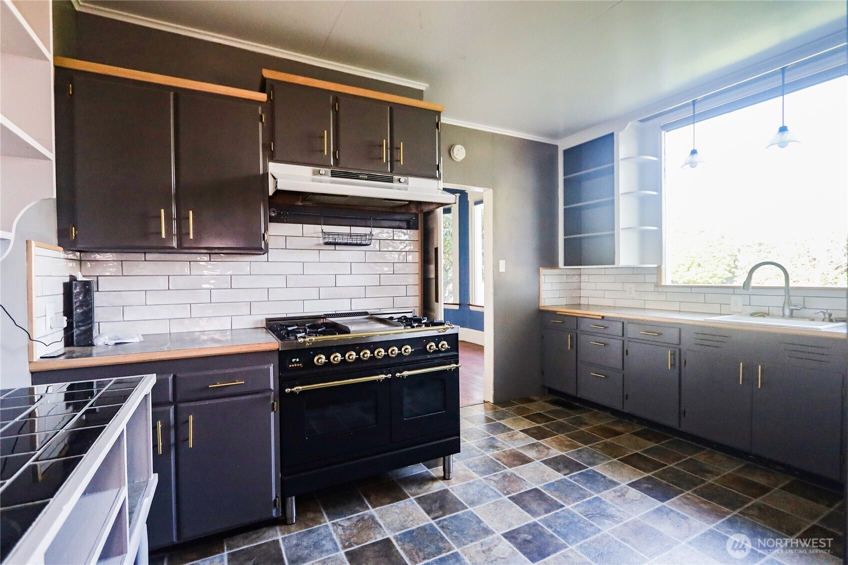 505 K Street Hoquiam, WA 98550 - Photo 9 of 40 a kitchen with stainless steel appliances a stove and a sink