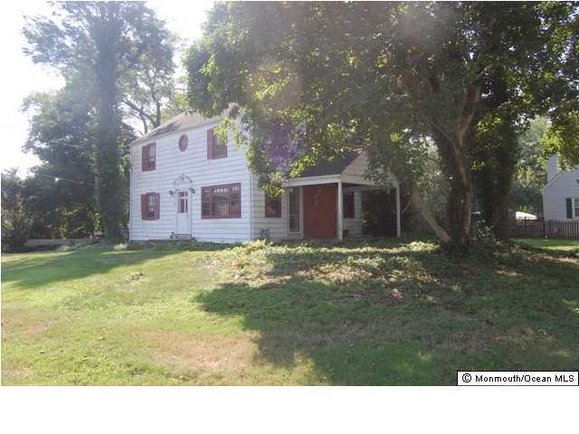 148 Tindall Road Middletown, NJ 07748 - Photo 1 of 3 a view of a house with a yard