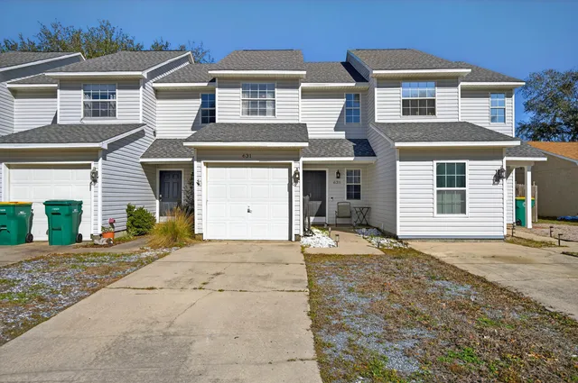 a front view of a house with a garage