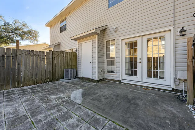 a front view of a house with a large window