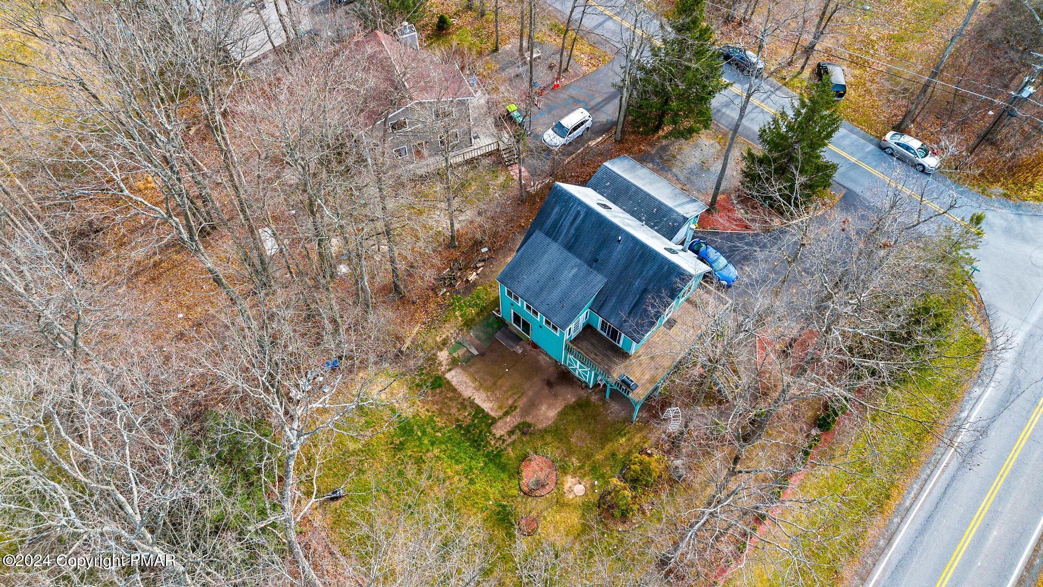 203 Coach Road Tobyhanna, PA 18466 - Photo 8 of 45 a view of a backyard with plants and a garden