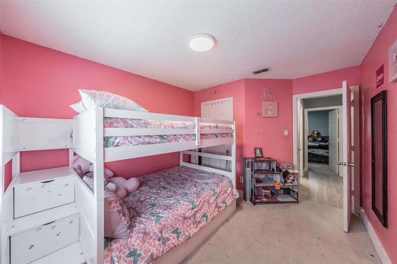 4520 Wedgecrest Drive Dallas, TX 75232 - Photo 11 of 19 a bedroom with a bed and a couch