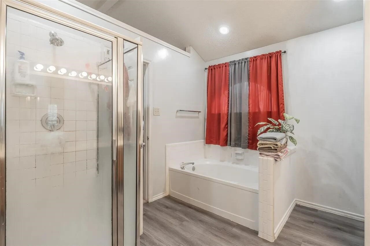 4520 Wedgecrest Drive Dallas, TX 75232 - Photo 5 of 19 a bathroom with a shower and a sink