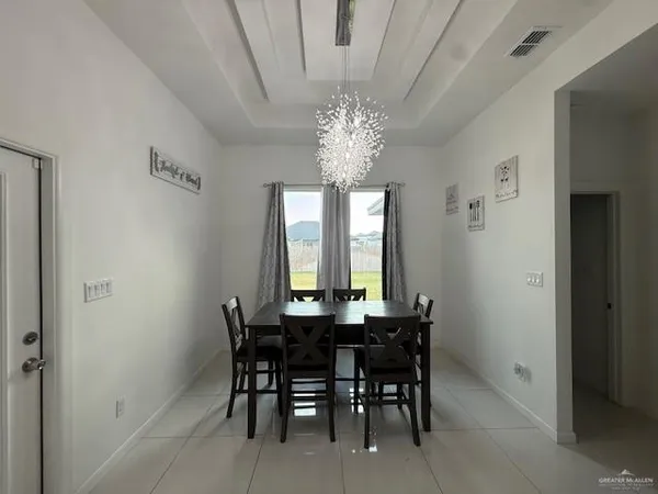 a view of a dining room with furniture and window