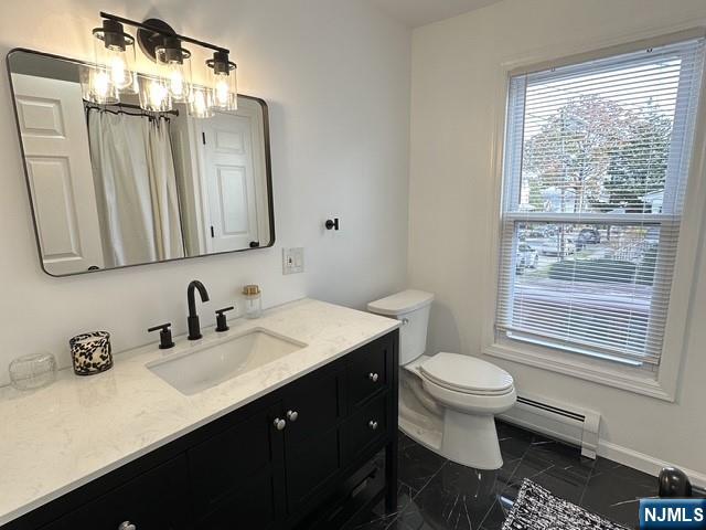 195 Valley Road, Unit 1 Clifton, NJ 07013 - Photo 5 of 8 a bathroom with a granite countertop sink toilet a mirror and a window