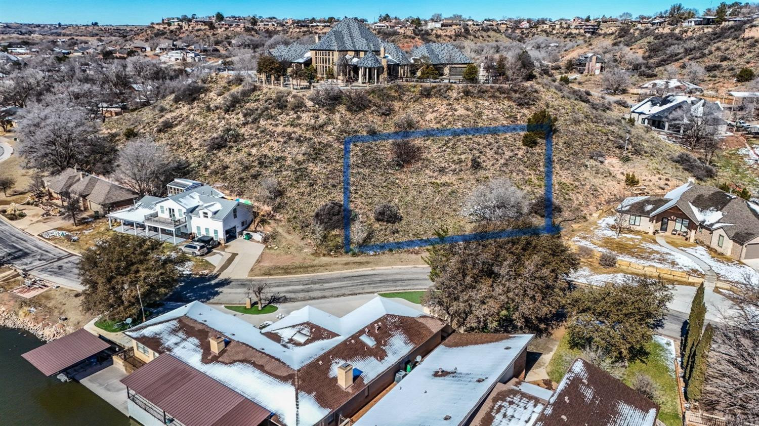 26 East Lakeshore Drive Ransom Canyon, TX 79366 - Photo 2 of 9 an aerial view of multiple house with yard