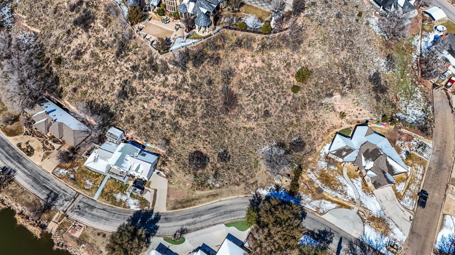 26 East Lakeshore Drive Ransom Canyon, TX 79366 - Photo 7 of 9 an aerial view of a house