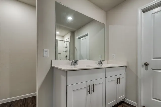 a bathroom with a sink and mirror