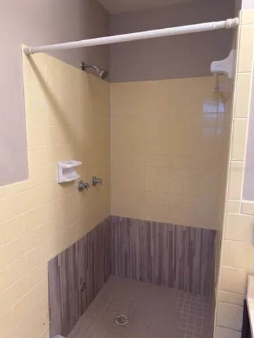 a view of hallway with a mirror