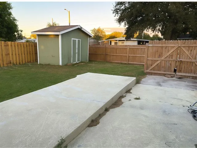 a kitchen with stainless steel appliances granite countertop a stove a sink dishwasher and a refrigerator