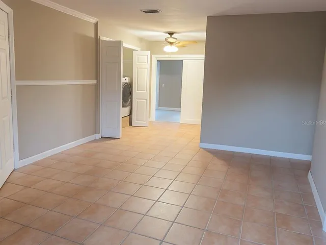 a view of an empty room and window
