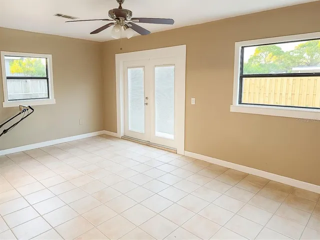 a view of an empty room with a window