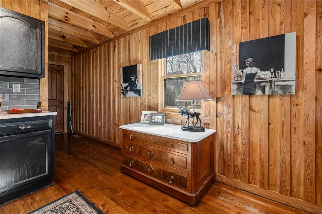 109 Carolina Cove Road Seneca, SC 29672 - Photo 11 of 45 This interior features rich wood paneling, wood flooring, and a window for natural light.