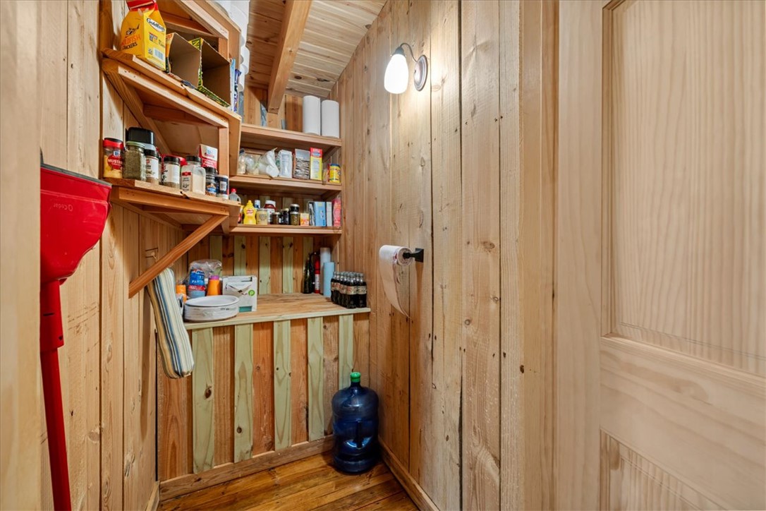 109 Carolina Cove Road Seneca, SC 29672 - Photo 15 of 45 This functional pantry features ample shelving and a rustic wood finish.