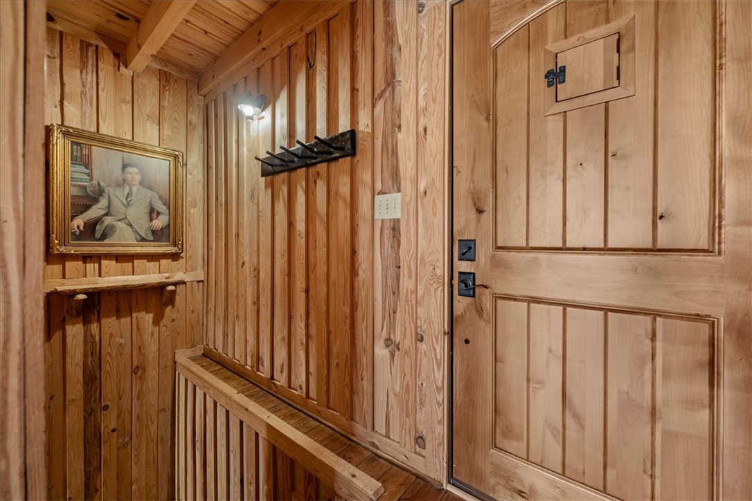 109 Carolina Cove Road Seneca, SC 29672 - Photo 24 of 45 Enter a rustic interior with a solid wood door and steps to the lower level are directly to the right.