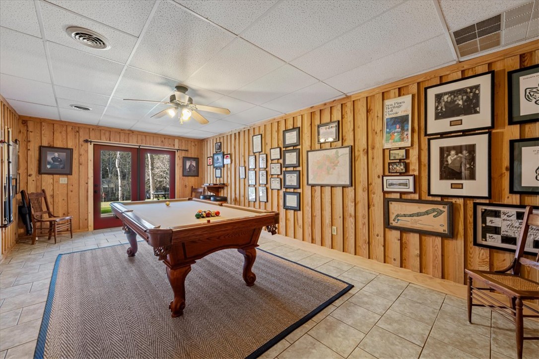 109 Carolina Cove Road Seneca, SC 29672 - Photo 26 of 45 This versatile recreation space offers ample room for games or 4th bedroom with access to the outdoors outdoor patio, putting green and fire pit.