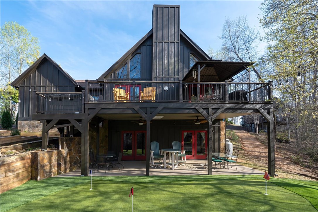 109 Carolina Cove Road Seneca, SC 29672 - Photo 3 of 45 This charming home offers outdoor living with a spacious deck and putting green.