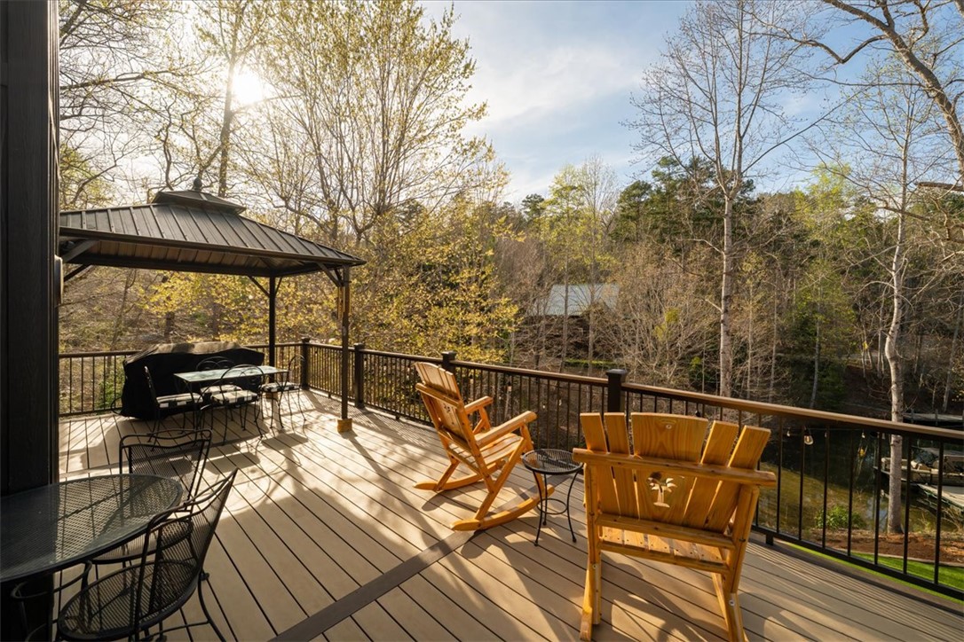 109 Carolina Cove Road Seneca, SC 29672 - Photo 32 of 45 This spacious deck with a new gazebo provides an idyllic setting for outdoor relaxation views of the lake.