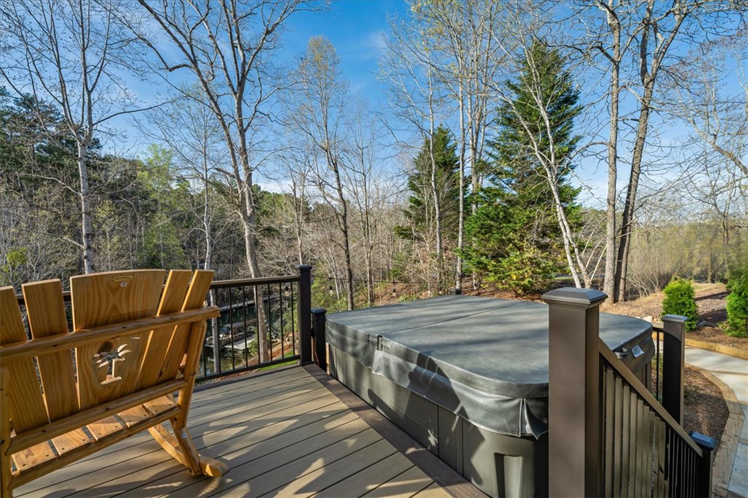 109 Carolina Cove Road Seneca, SC 29672 - Photo 33 of 45 This serene deck offers a private hot tub, perfect for unwinding amidst tranquil natural surroundings.