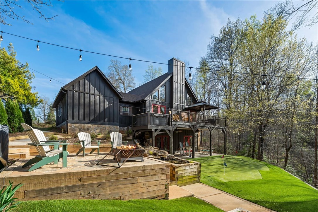109 Carolina Cove Road Seneca, SC 29672 - Photo 35 of 45 Flagstone fire pit overlooking the water. Illuminated with lights at night!